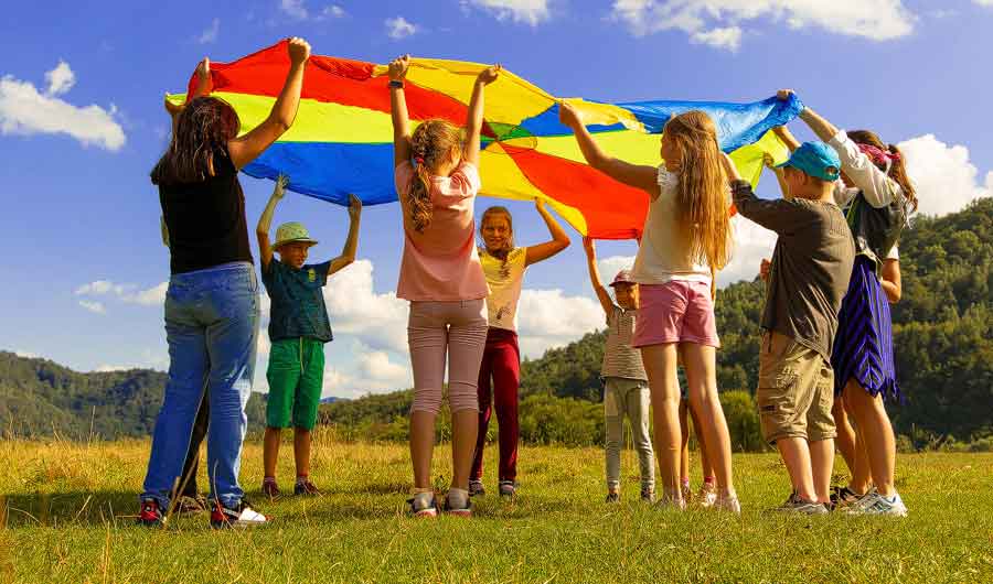 Kids playing Playground parachute