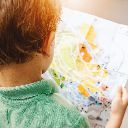 kid looking at map